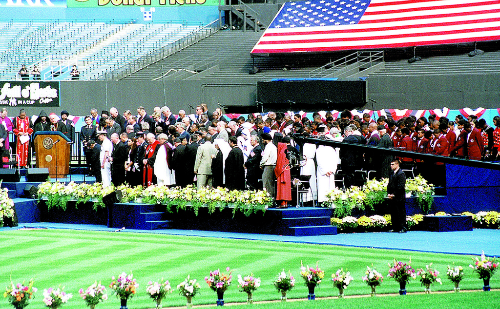 SERVICE—Cardinal Egan leads prayer at
Interfaith Prayer Service held Sept. 23,
2001, at Yankee Stadium. Religious and political leaders in the city participated.