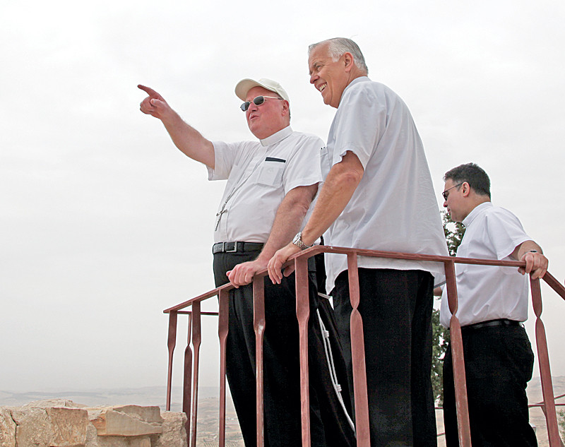 On a visit to Mount Nebo, Cardinal Dolan points out a landmark in the distance to Msgr. John Kozar, president of the Catholic Near East Welfare Association (CNEWA).