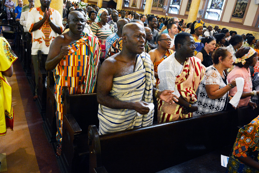 Members of the Ghanaian Catholic community, in colorful national dress, joyfully participate in a festive Mass Aug. 2 as new members of St. Luke’s parish in the Bronx.