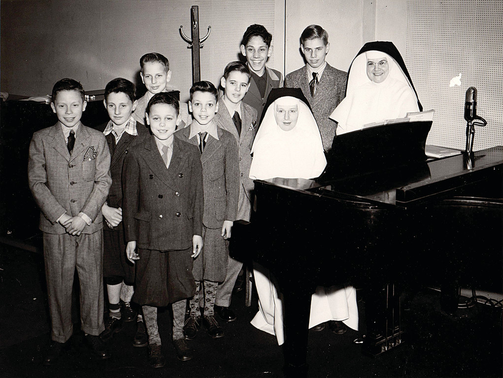 Two Dominican Sisters of Blauvelt pose for a group photos with boys from St. Dominic’s Home in the early 1950s.