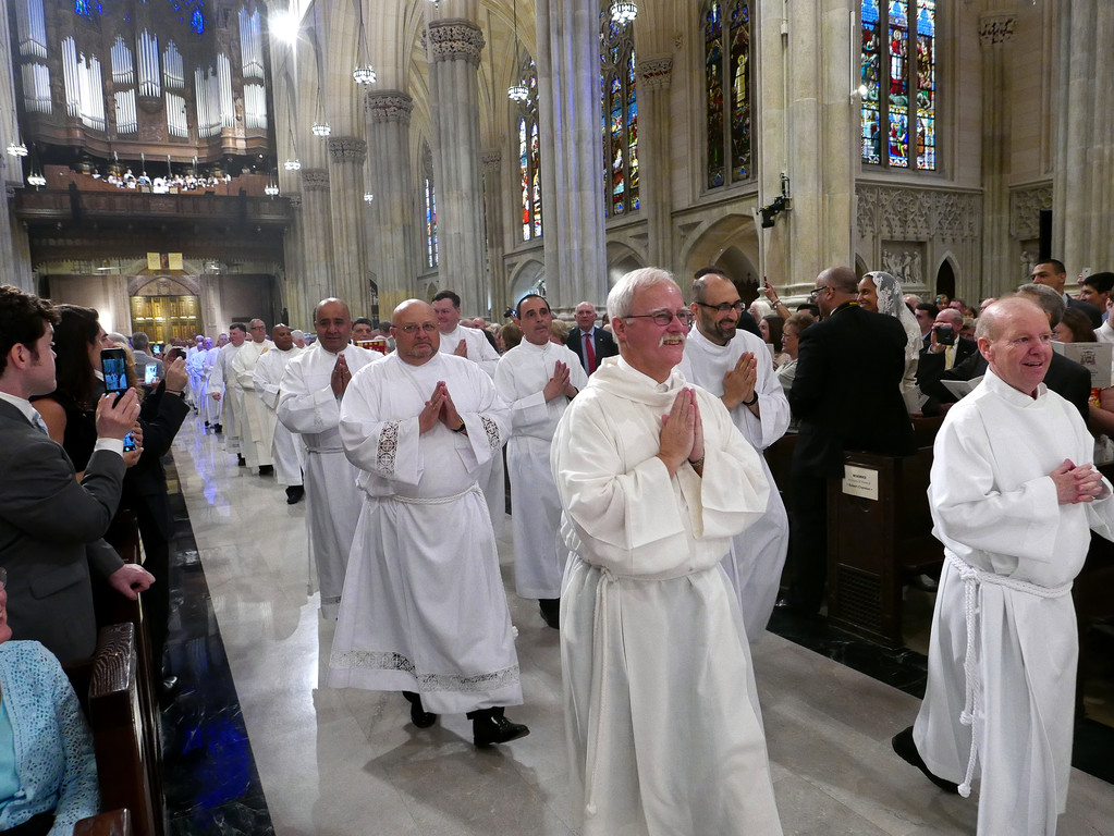 ORDINATION AWAITS—Deacon Robert Cranston and Deacon Michael Hall lead the procession at the Mass of Ordination in St. Patrick's Cathedral on June 25 for the 12 men who were ordained to serve as permanent deacons in the archdiocese.