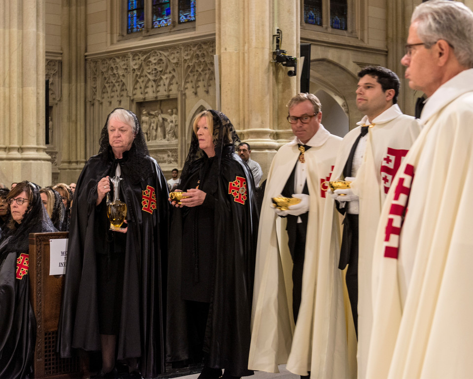 Knights and ladies from the Equestrian Order of the Holy Sepulchre of Jerusalem’s Eastern Lieutenancy of the United States bring forward the Eucharistic gifts during the Mass of Investiture at St. Patrick’s Cathedral on Nov. 18.