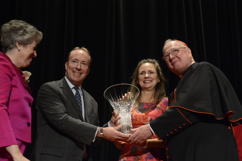 Whitney and Clarke Murphy receive the Spirit of St. Nicholas Award from Cardinal Dolan and Mary Buckley Teatum, president of the Ladies of Charity