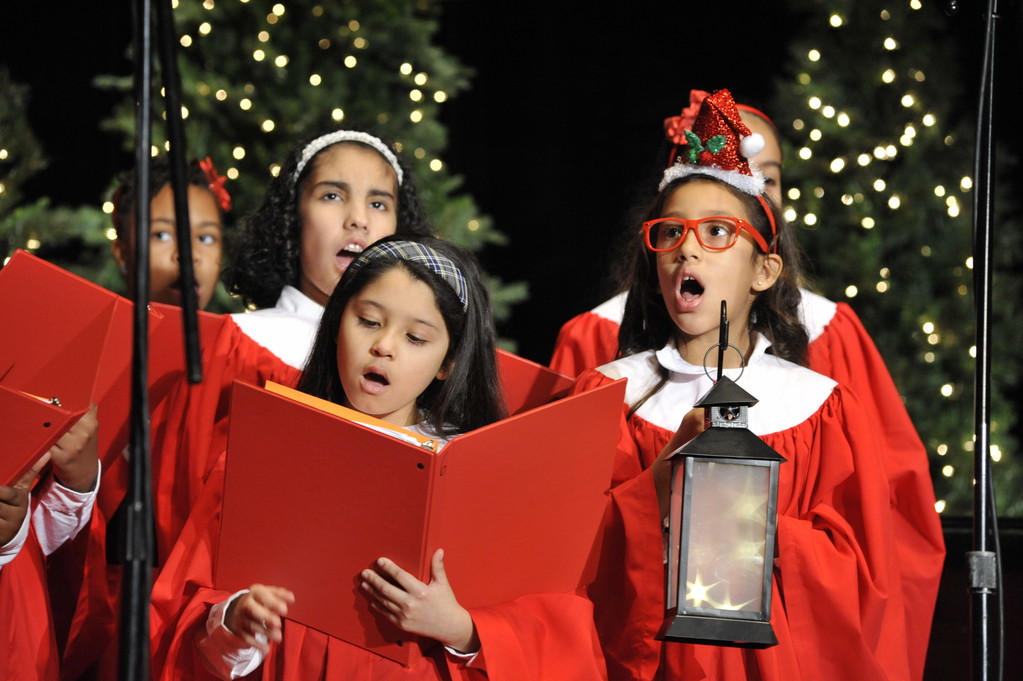 Brianna Canales-Paz, left, and Xilina Ortiz perform with the St. Raymond School Choir of the Bronx at the 71st annual Cardinal’s Christmas Luncheon at the Waldorf Astoria on Dec. 5. The choir was singing Christmas favorites as guests entered the grand ballroom and later performed with bass-baritone Ryan Speedo Green.