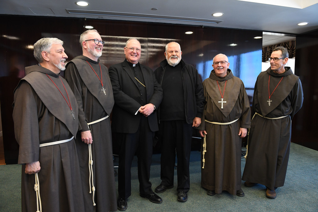 Father James Puglisi, S.A.; Father Brian Terry, S.A.; Cardinal Dolan; Father Emil Tomaskovic, S.A.; Father Charles Sharon, S.A., and Father Daniel Callahan, S.A., gather following the closing of the cause.
