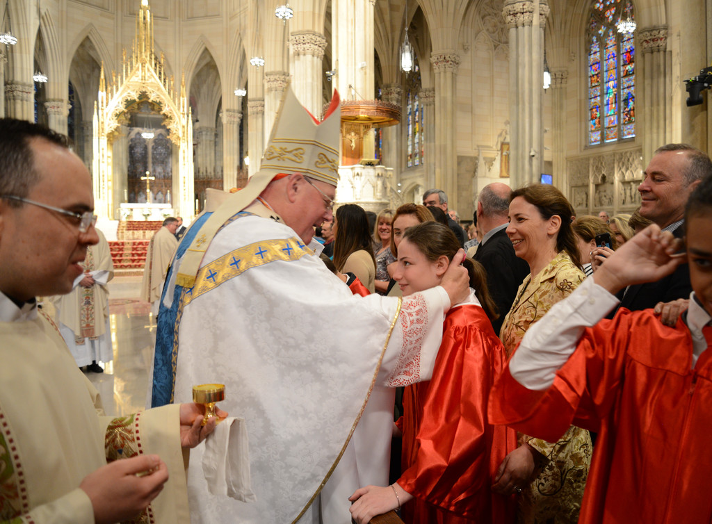 Cardinal Dolan offers a special Confirmation Mass for Youths with Disabilities on May 14 at St. Patrick’s Cathedral. Katherine Robb of St. Patrick’s parish in Bedford shows her happiness as a confirmand.
