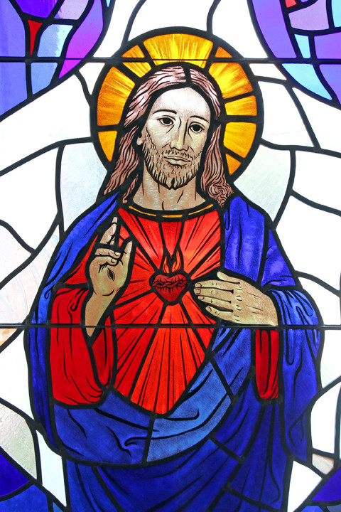 LOVING HEART—The Sacred Heart of Jesus is depicted in a stained-glass window at St. Patrick Church in Smithtown. The feast of the Sacred Heart of Jesus is June 8 this year.