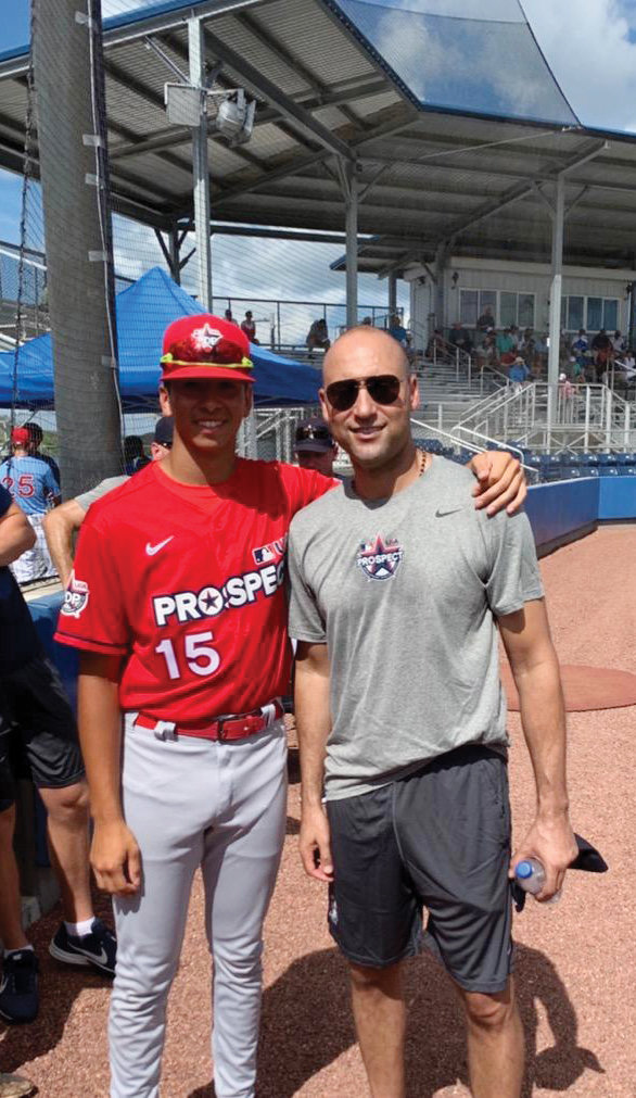 Jeter meets Mount St. Michael Academy student Alex Santos at the Prospect Development Pipeline League at the IMG Academy in Bradenton, Fla., last summer.