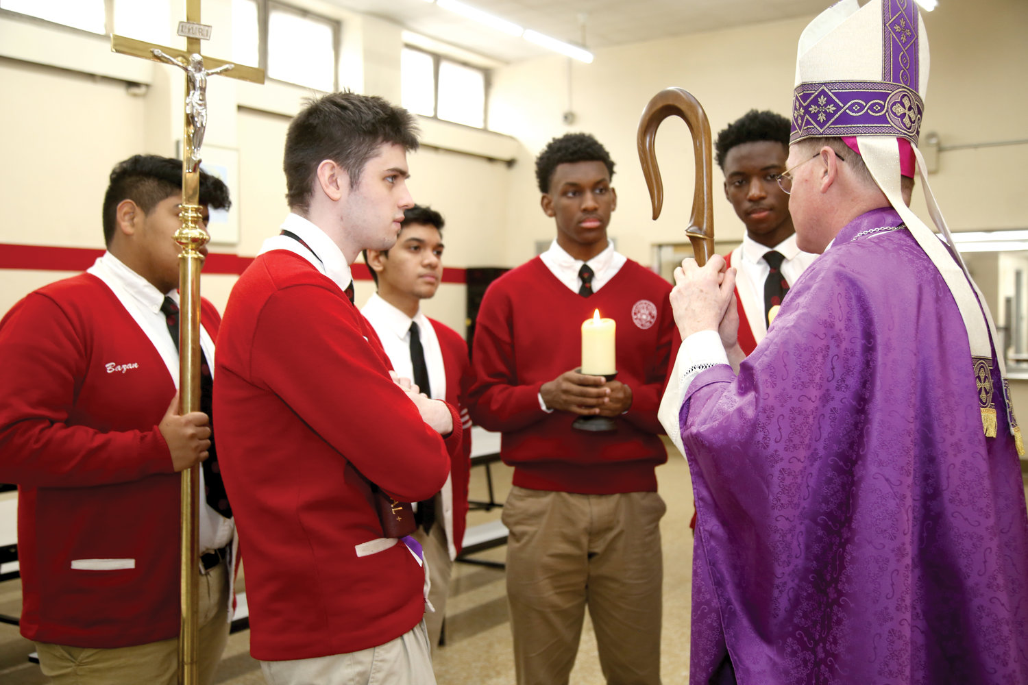 The bishop meets with members of La Salle’s Class of 2020 who served at the altar during the Mass. From left, they are Brian Bazan, Daniel Betancourt, Dylan Almeida, Theo Noble and Amadou Kouyate.
