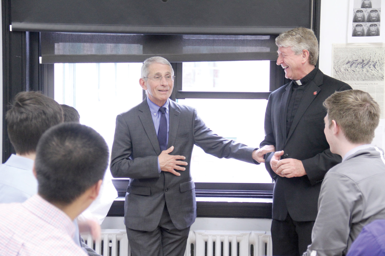 DISTINGUISHED ALUMNUS—Dr. Anthony Fauci meets with Regis High School students and the school’s president, Jesuit Father Daniel Lahart, in 2019. Dr. Fauci graduated from the school in 1958.
