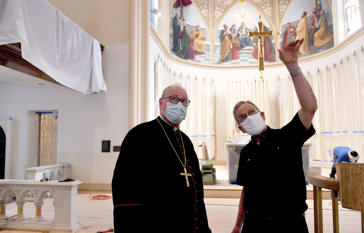 Father Thomas Madden, pastor of St. Peter and St. Mary of the Assumption parish, gives Cardinal Dolan a tour of the parish church, which is being renovated.