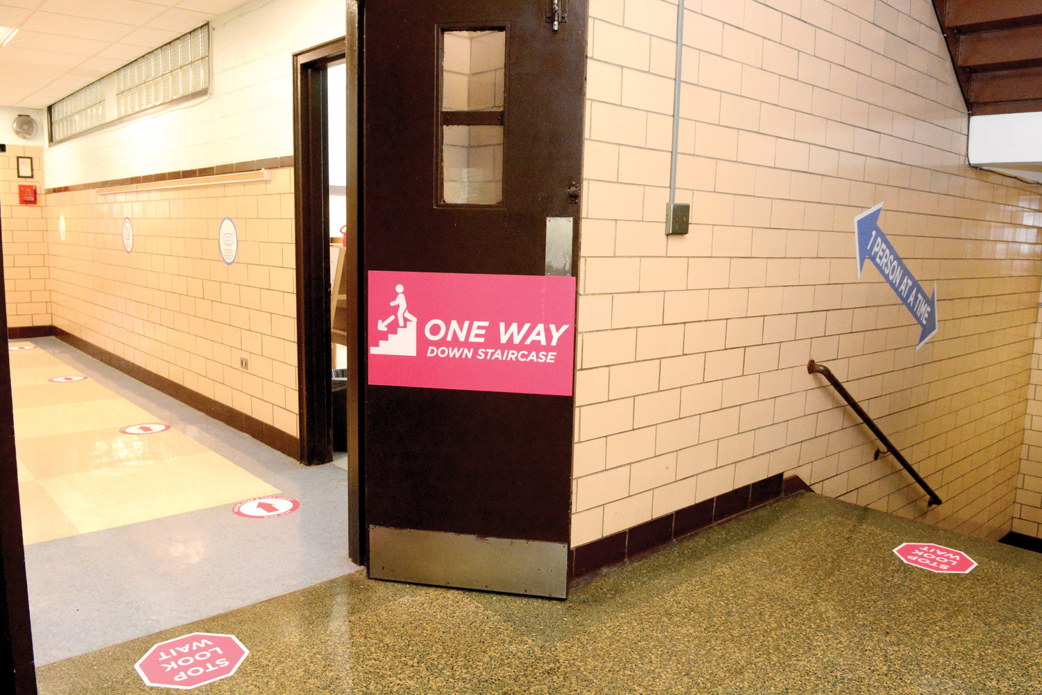 A user-friendly grid of arrows and social distance stickers will help elementary school students navigate the new normal at Immaculate Conception School on East Gun Hill Road, the Bronx.