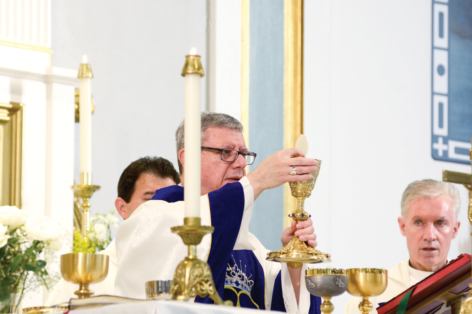 TABLE OF THE LORD—Auxiliary Bishop Gerardo J. Colacicco prays during the consecration of the Eucharist at the Vigil Mass for the Feast of the Assumption of the Blessed Virgin Mary Aug.14 at Assumption Church in Peekskill.
