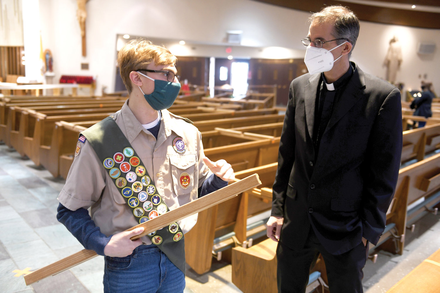 Decina speaks with Father Thomas Byrnes, pastor of St. Anthony of Padua.