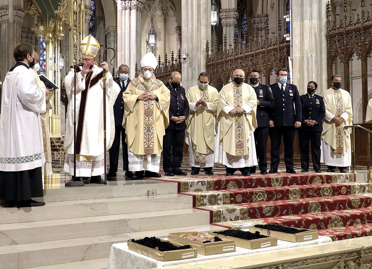 Cardinal Dolan served as the principal celebrant and homilist at a Memorial Mass Oct. 5 at St. Patrick’s Cathedral for 46 NYPD officers and other employees who have died of the coronavirus. The cardinal blessed the Guardian Angel medallions distributed at the end of Mass.