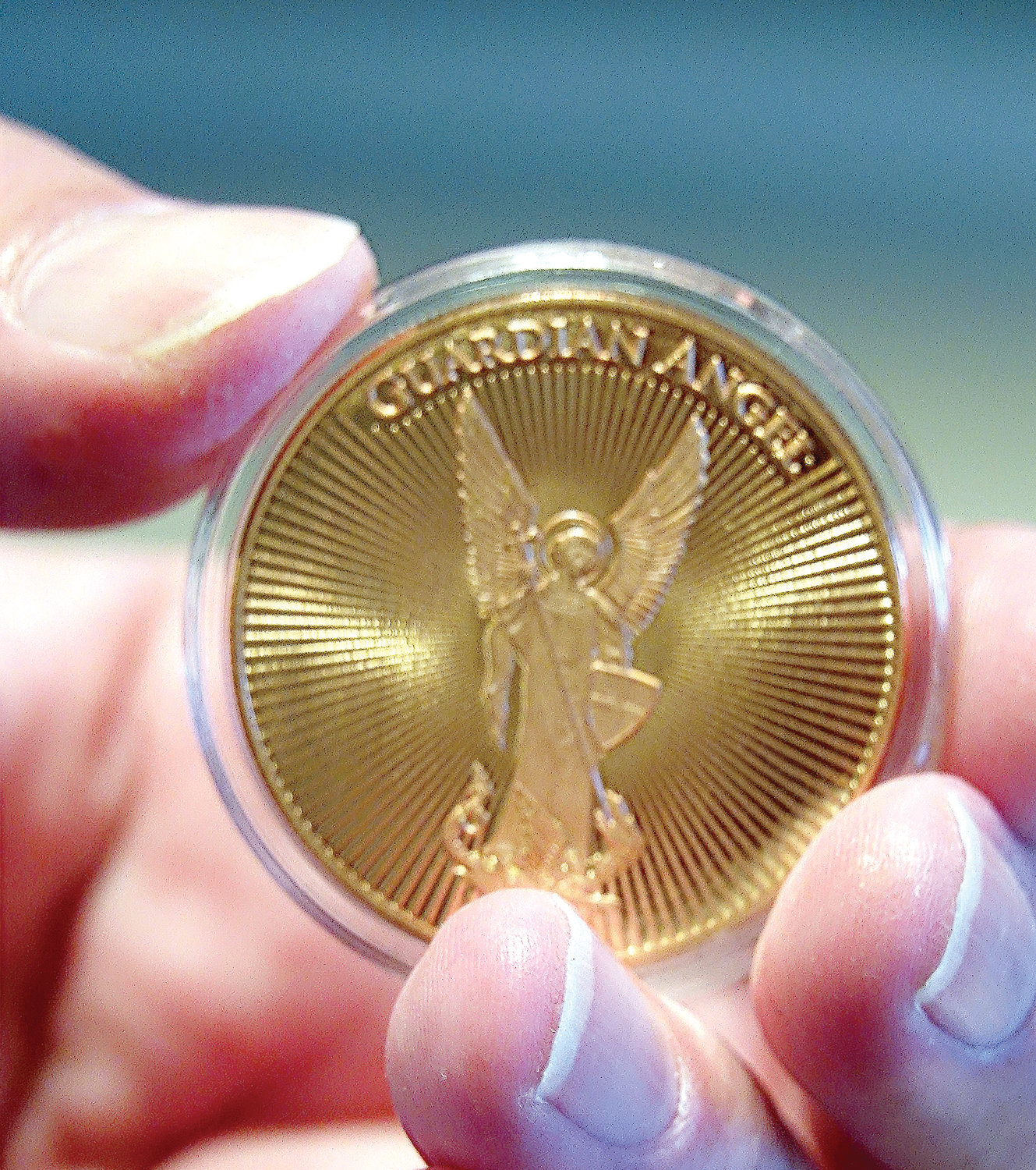 One of 500 archdiocesan Guardian Angel medallions blessed by Cardinal Dolan and distributed to the victims’ families.