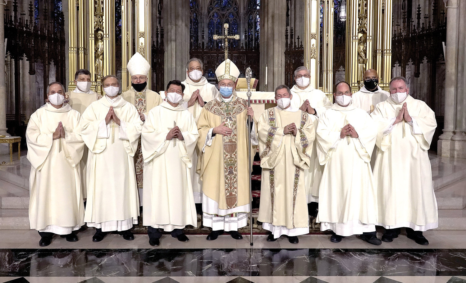 CLASS OF 2020—Auxiliary Bishop Edmund Whalen, center, ordained eight new permanent deacons to serve at parishes in the archdiocese Oct. 31 at St. Patrick’s Cathedral. Due to the coronavirus pandemic, safety protocols remain in place, including face masks. Front row, from left: Deacon Keith White, Deacon Mark Wisniewski, Deacon Jonathan Reyes, Auxiliary Bishop Edmund Whalen, Deacon Harold Hochstein, Deacon Paul Stolz and Deacon Dennis McCormack. Back row: Deacon Francis Orlando, director of diaconate formation in the archdiocesan Diaconate Office; Brooklyn Auxiliary Bishop James Massa, rector of St. Joseph Seminary, Dunwoodie; Deacon Stephen Broussard, Deacon Kevin McGuirk and Deacon James Bello, director of diaconate ministry and life in the Diaconate Office.