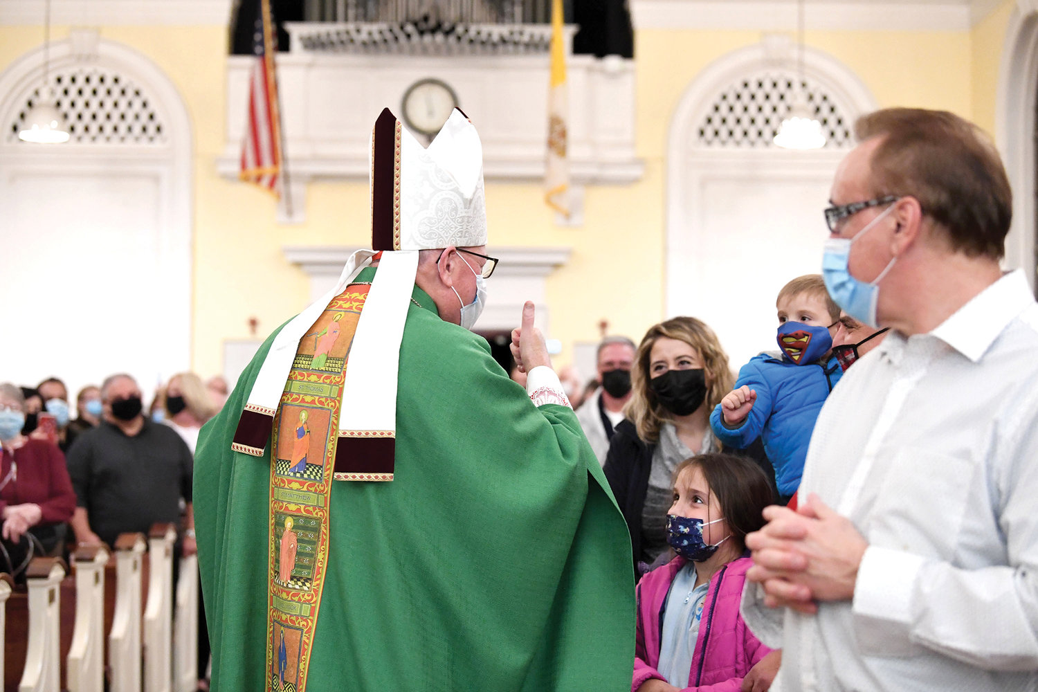 Cardinal Dolan greets people at the end of the Mass.