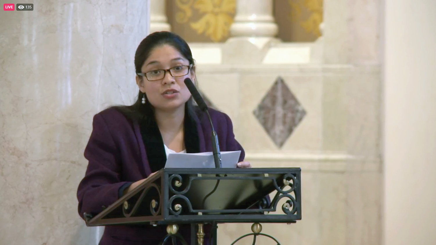 Elizabeth Guevara de Gonzalez, director of archdiocesan Adult Faith Formation, at the lectern, thanked the cardinal and auxiliary bishops who led the monthly livestreamed Holy Hours, which began in March 2020.