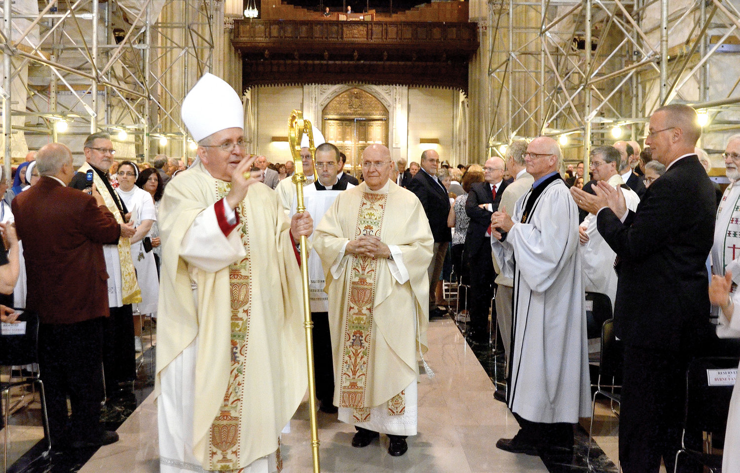 Auxiliary Bishop John J. O’Hara offers blessings at August 2014 Mass in St. Patrick’s Cathedral in which Cardinal Dolan ordained him to the episcopacy.