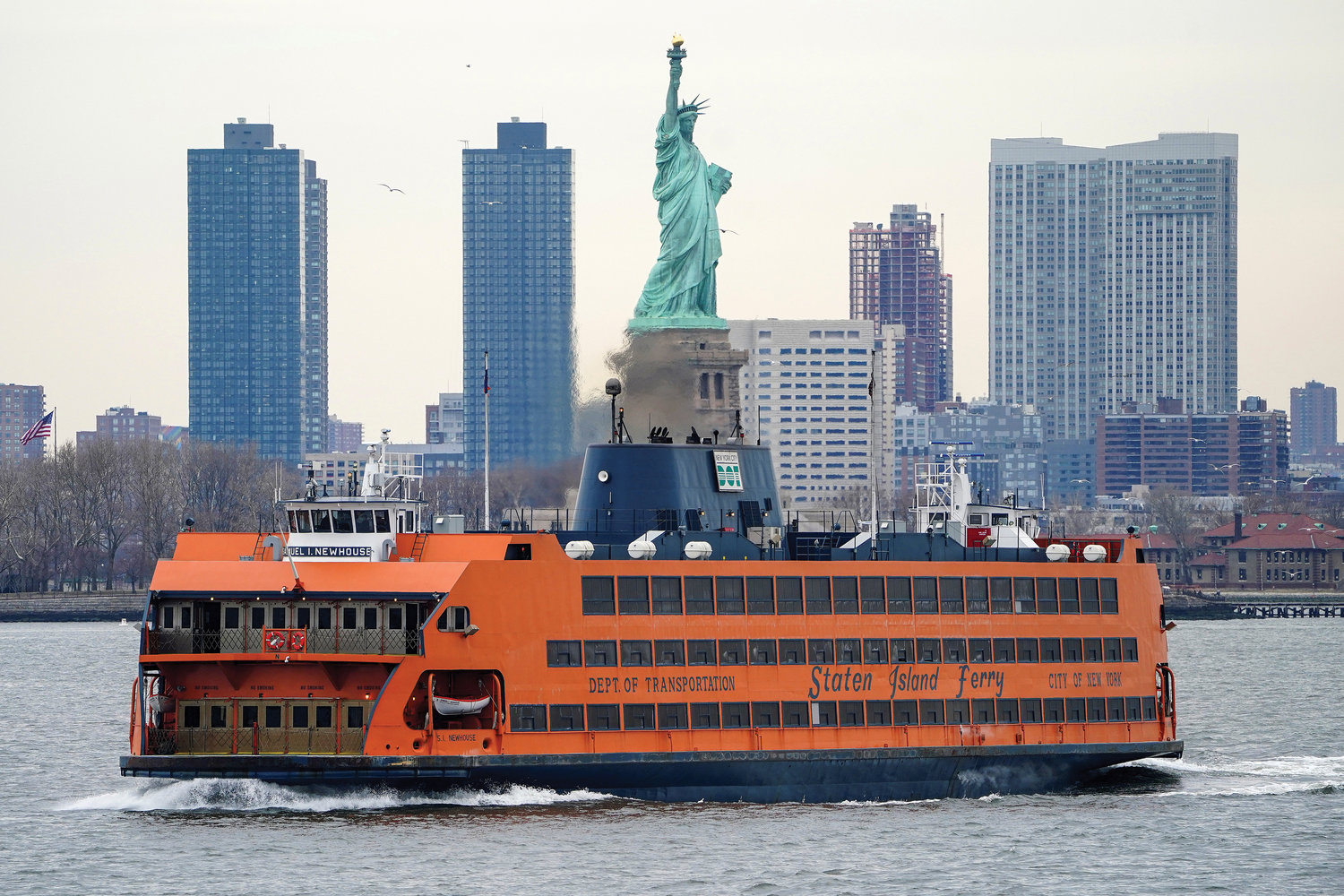 The Staten Island Ferry moves past the Statue of Liberty in New York City. Mayor Bill de Blasio announced March 25 that one of three new Staten Island Ferry boats will be named for Catholic Worker Movement co-founder Dorothy Day, whose sainthood cause is being considered by the Vatican.