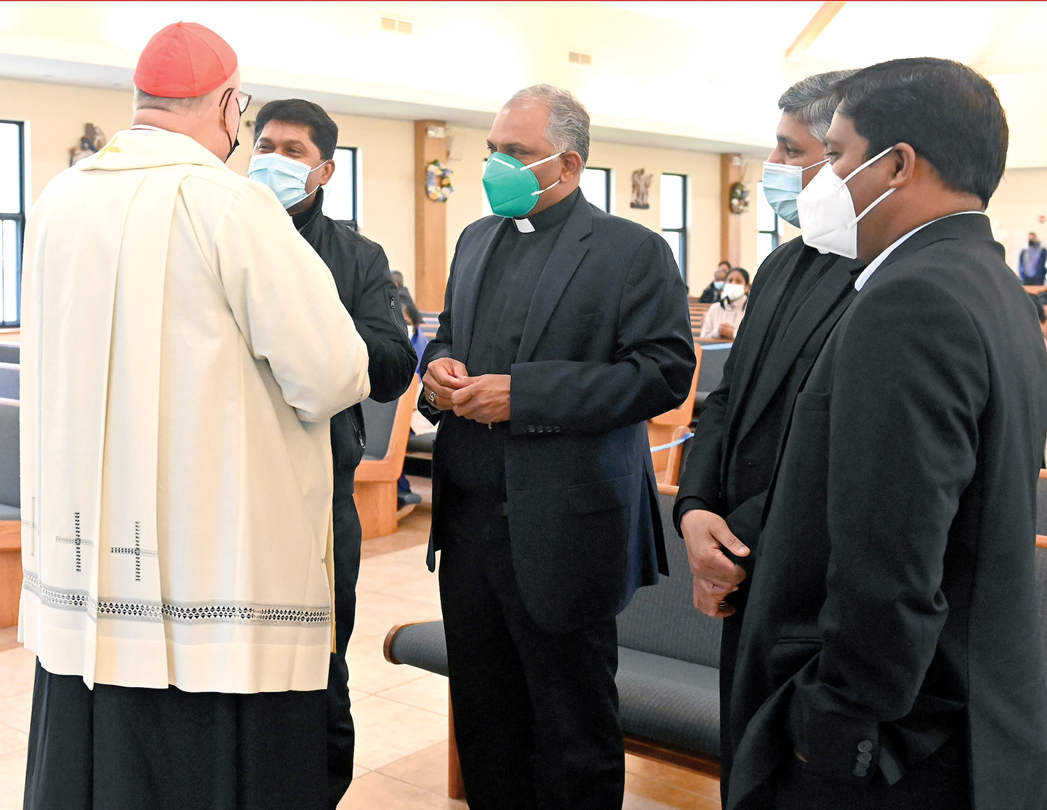 The cardinal speaks with four priests who are natives of India now serving in the Archdiocese of New York that each led a decade of the Rosary. From left, they are Father Bipy Mathew Tharayil, Father Ravi K. Dasari, C.O., Father Francis Dasari and Father Joseph Narisetty, C.O.