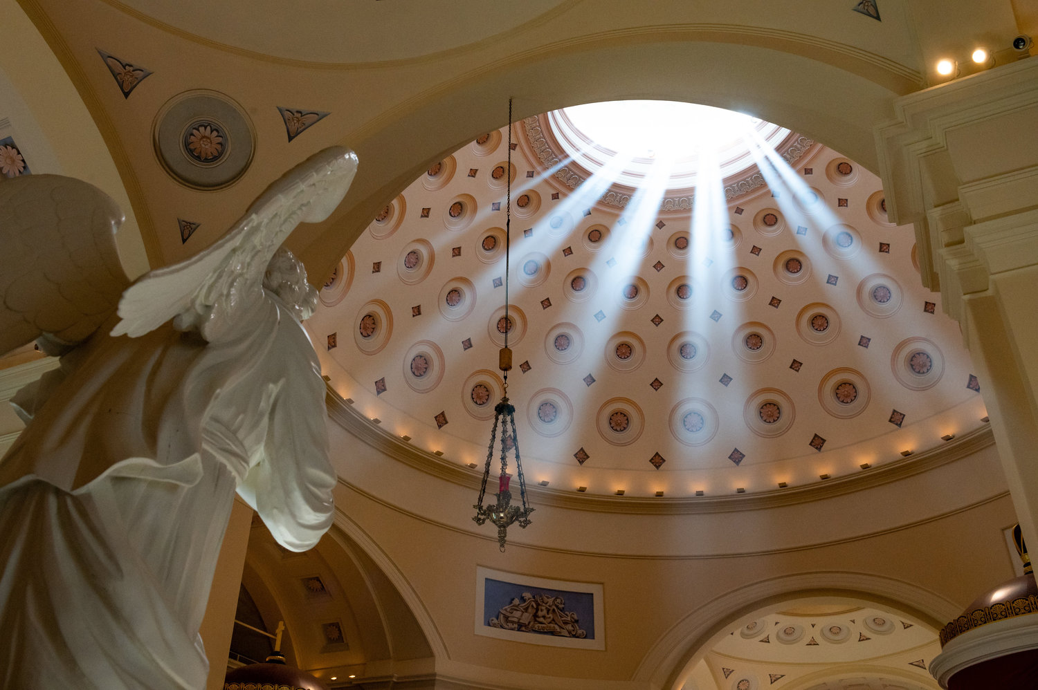 SHINING MOMENT—The afternoon sun shines through the dome of the Basilica of the National Shrine of the Assumption of the Blessed Virgin Mary in Baltimore May 31 shortly after the conclusion of a Mass celebrating the 200th anniversary of the basilica’s dedication.