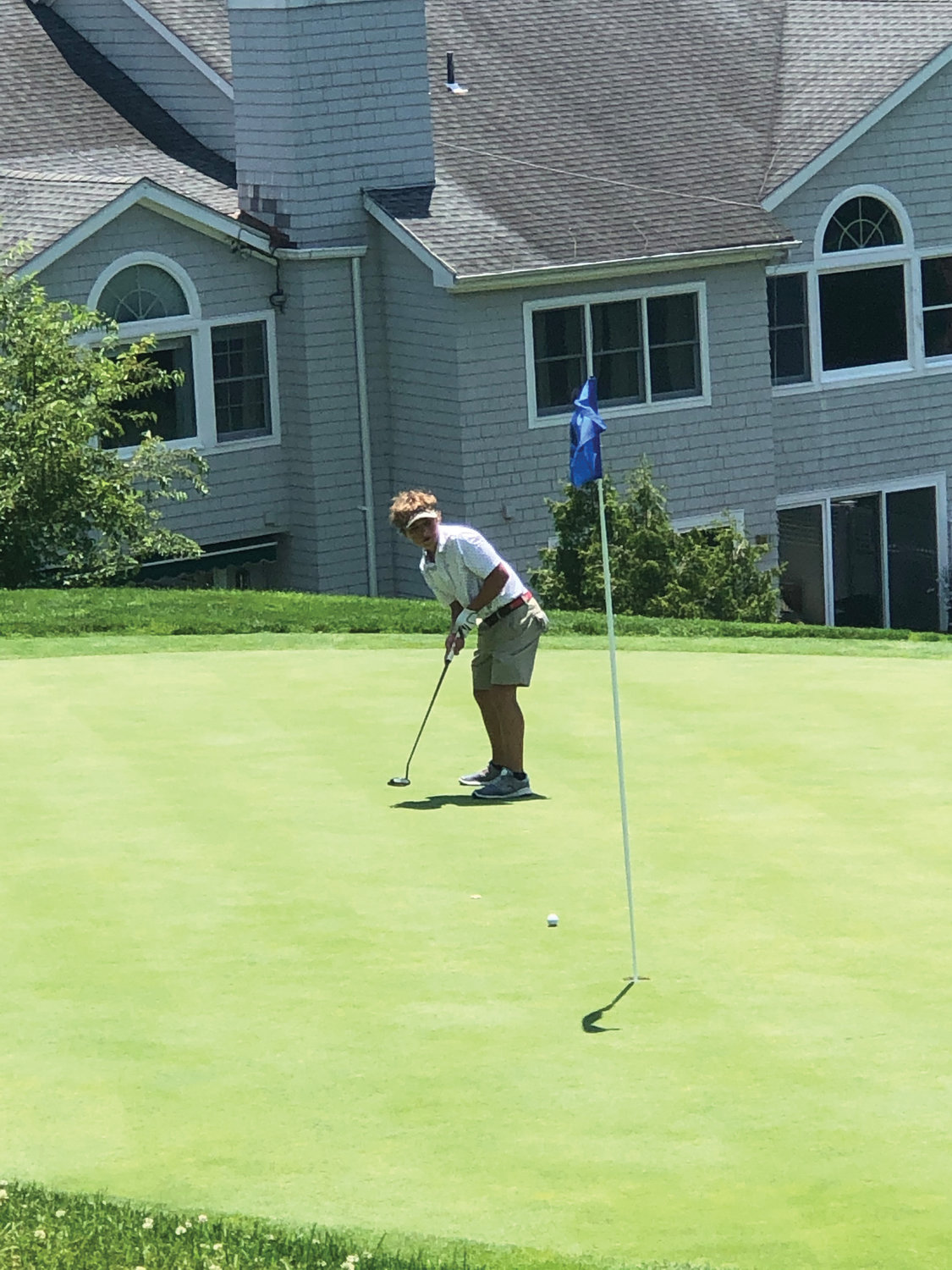 Matthew Clyman, a parishioner of St. Elizabeth Ann Seton in Shrub Oak, attempts a putt on his way to winning the seventh- and eighth-grade division at the Westchester Putnam CYO Junior Golf Outing at Pleasantville Country Club June 28.