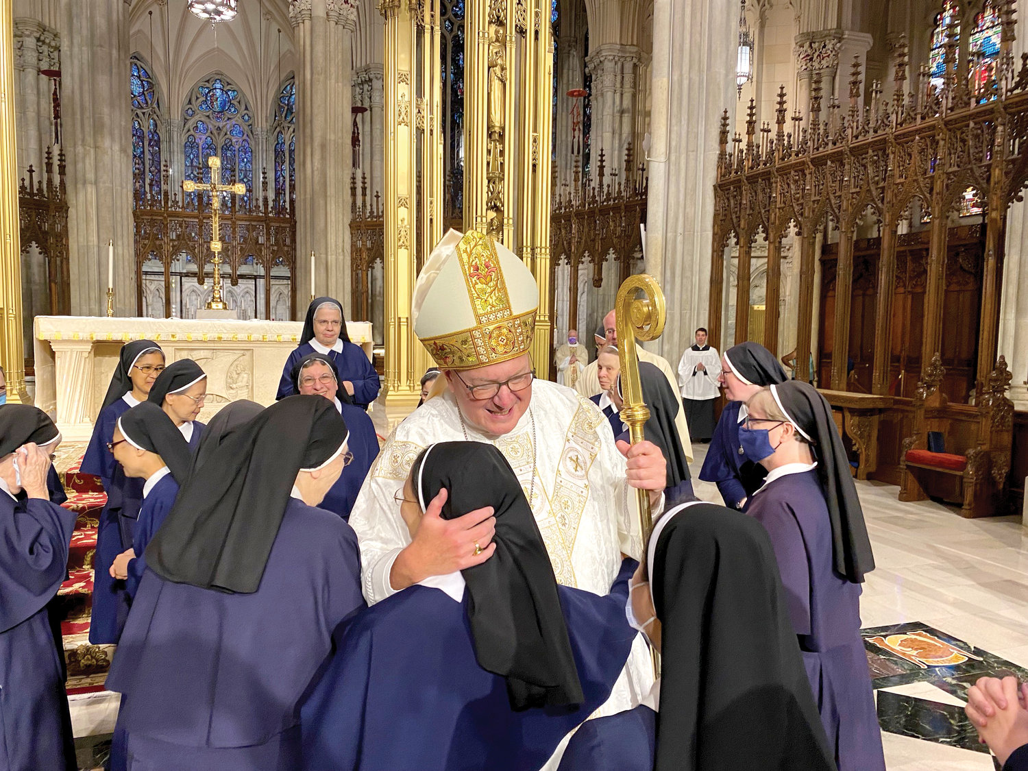 Cardinal Dolan warmly greets sisters.