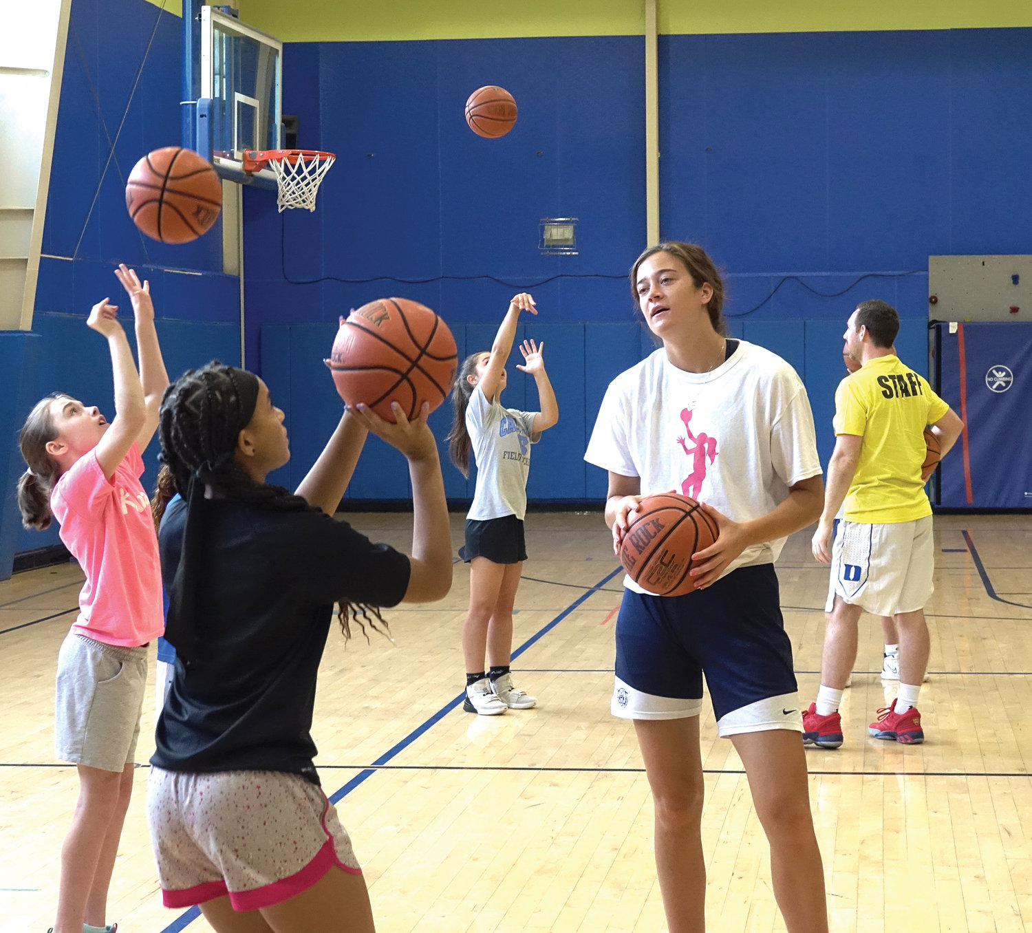 HOMECOMING—Our Lady of Lourdes High School graduate and Villanova University women’s basketball star Maddy Siegrist offers instruction in basketball fundamentals at the Maddy Siegrist Girls’ Basketball Clinic at Poughkeepsie Day School Aug. 16.