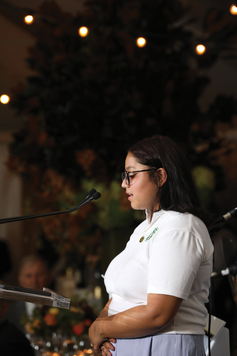 Elena Villa, a sophomore at Notre Dame High School in Manhattan, reads her winning entry in the Inner-City Scholarship Fund 50th Anniversary Poetry Contest.