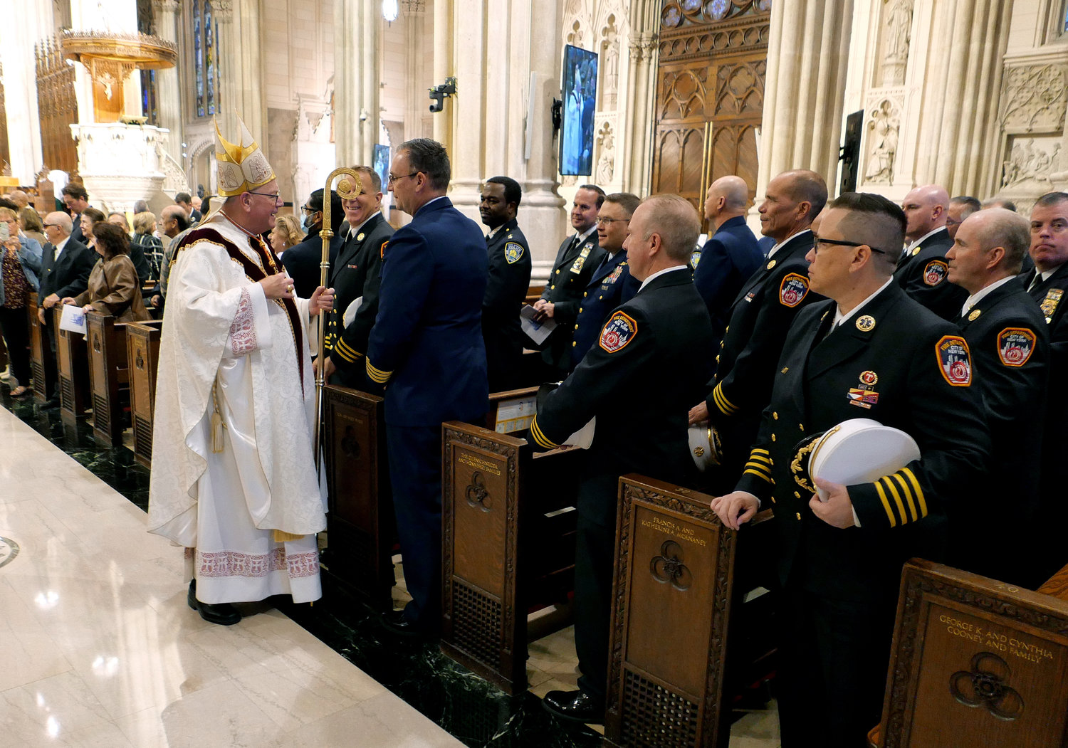 Cardinal Dolan greets members of the FDNY who protect and serve the people of New York following the annual Guardian Mass at St. Patrick’s Cathedral Oct. 1.