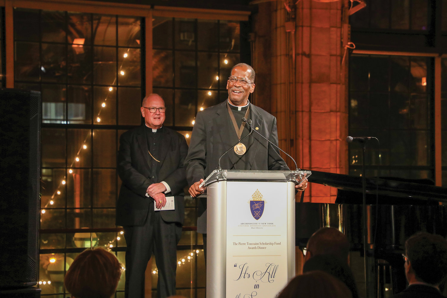 Honoree, Father Gregory Chisholm, S.J., former pastor of St. Charles Borromeo-Resurrection parish in Harlem, delivers his remarks.