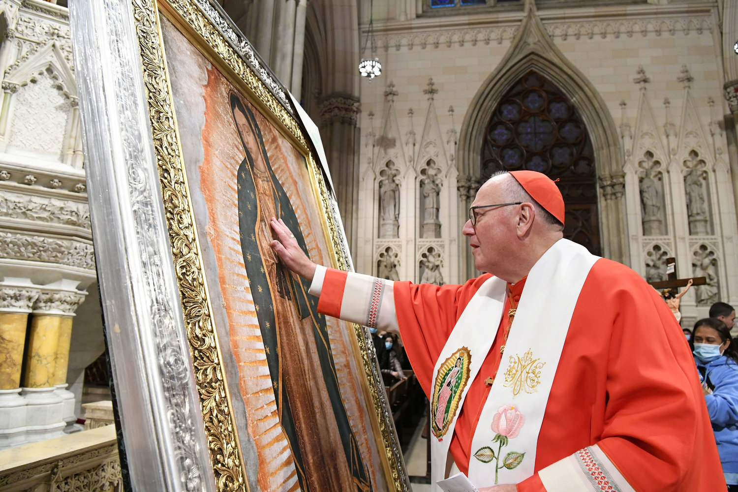 Cardinal Dolan venerates a portrait of Our Lady of Guadalupe Dec. 12 before the annual Our Lady of Guadalupe Mass at St. Patrick’s Cathedral. The cardinal gave welcoming remarks.