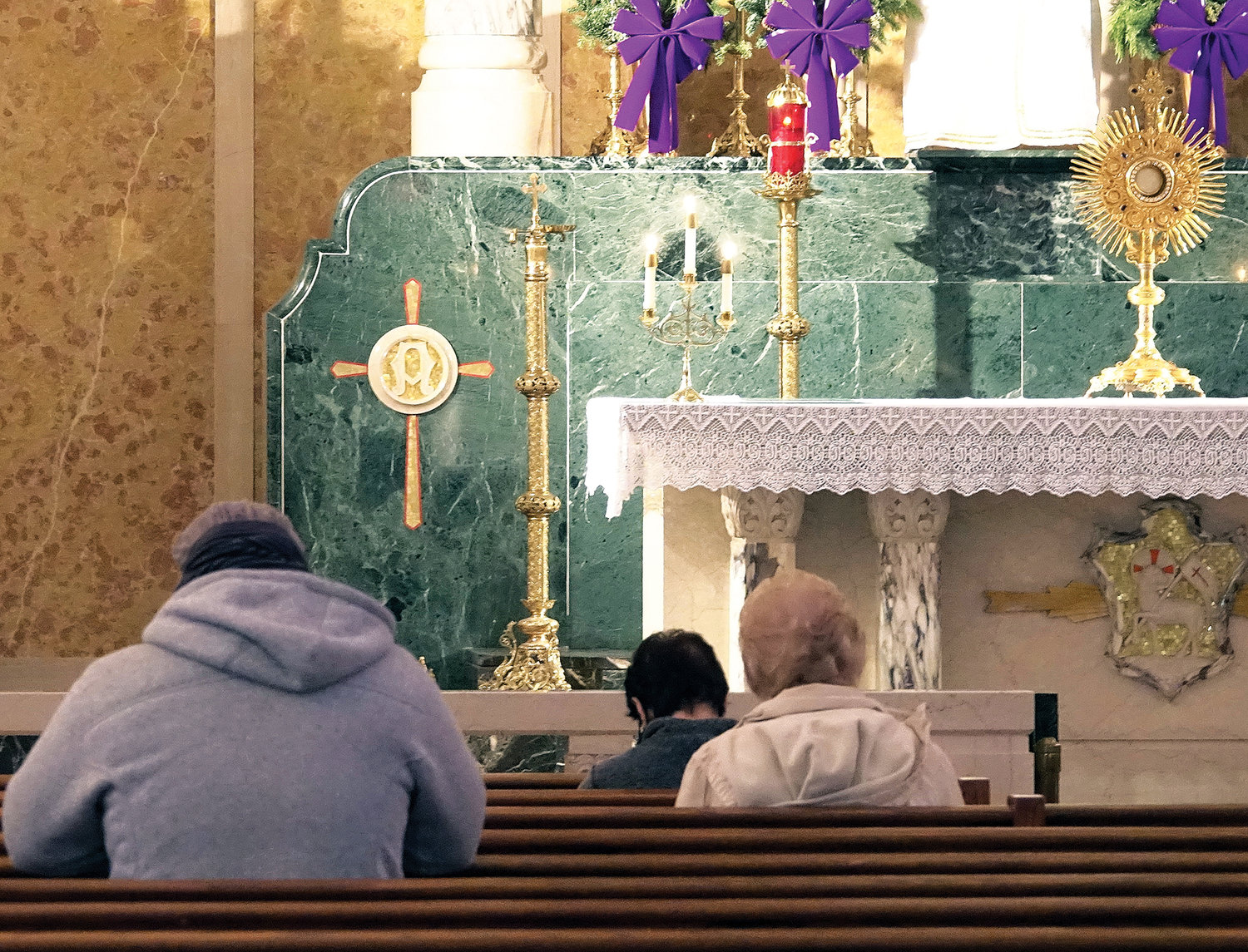 Members of the faithful pray during the liturgy. The parish hosted a Forty Hours Devotion Dec. 7-9 in conjunction with the Feast Day and conclusion of the universal Church’s Year of St. Joseph.