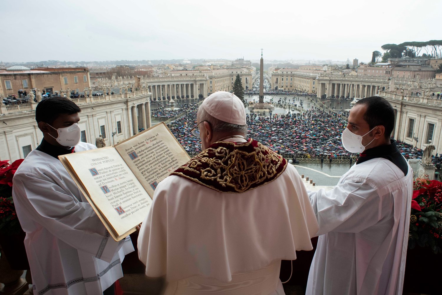 Pope Francis delivers Christmas blessing “urbi et orbi” (to the city and the world) from the central balcony of St. Peter’s Basilica at the Vatican Dec. 25.