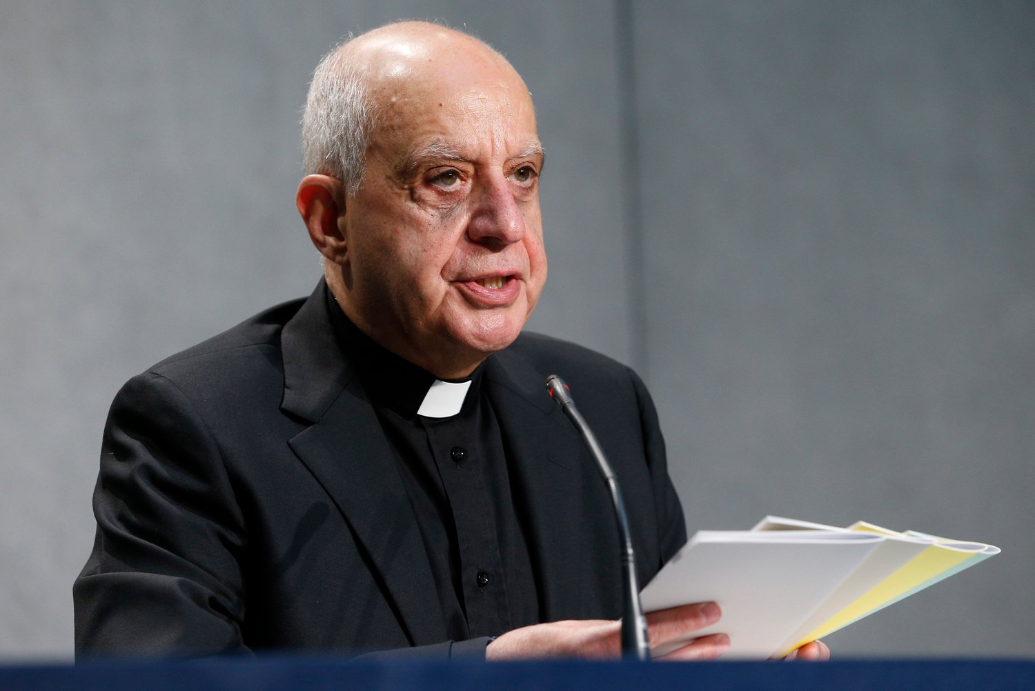 Archbishop Rino Fisichella, president of the Pontifical Council for Promoting New Evangelization, holds copies of Pope Francis’ document, “Antiquum Ministerium” (Ancient Ministry), during a news conference for the release of the document at the Vatican May 11, 2021. The archbishop is in charge of preparations for Holy Year 2025.
