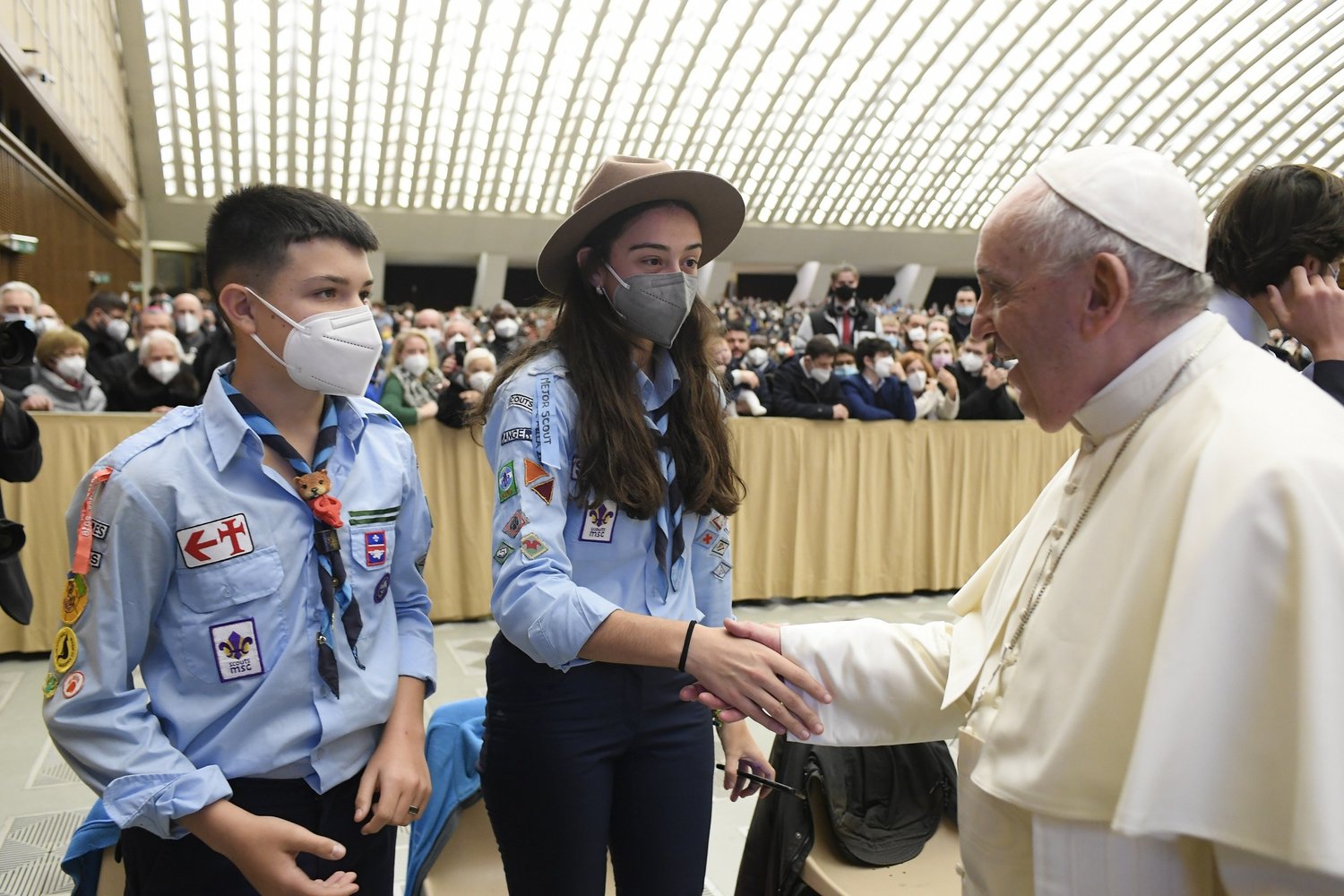 Pope Francis greets Scouts from Spain at the end of his weekly general audience Dec. 29 in the Vatican’s Paul VI hall.