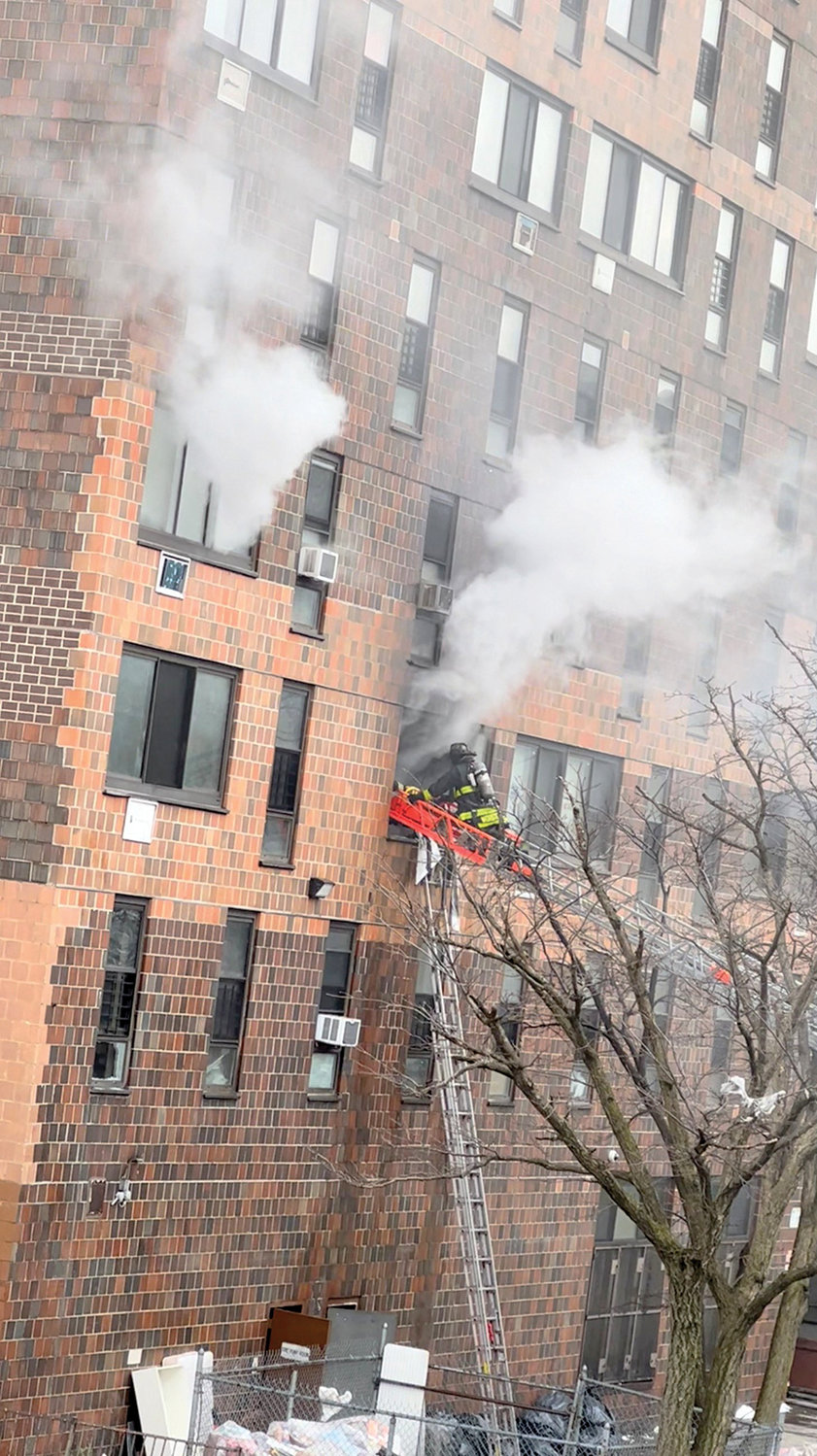 Smoke rises from windows during the devastating Jan. 9 Bronx apartment building fire, which killed 17 people, in this screen grab from a video obtained from social media.
