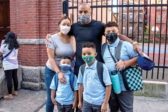 A photo of a school family taken outside the Academy of St. Ann and St. Paul in Manhattan. The Latino Outreach Program of the Superintendent’s office helps Hispanic families navigate the Catholic school application, enrollment and financial-aid processes, in Spanish and English.