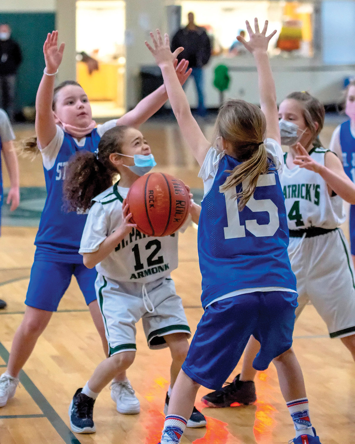 St. Patrick’s Olivia Moncion is defended by Scarlett Macnaughton of St. Joseph’s of Bronxville in a CYO third-grade girls game won by St. Joseph’s, 8-4.