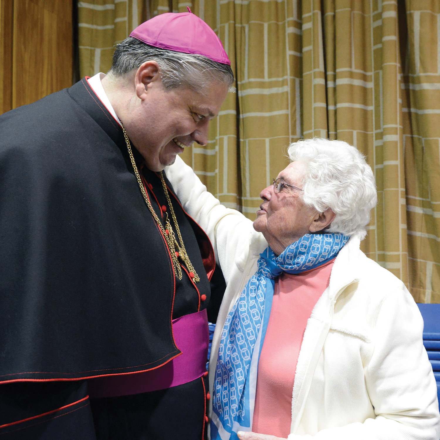 Bishop Bonnici gives his undivided attention to Sister Mary Stephen Healey, R.D.C., principal of Our Lady of Mount Carmel School, Elmsford. His first parish assignment was parochial vicar of Our Lady of Mount Carmel.