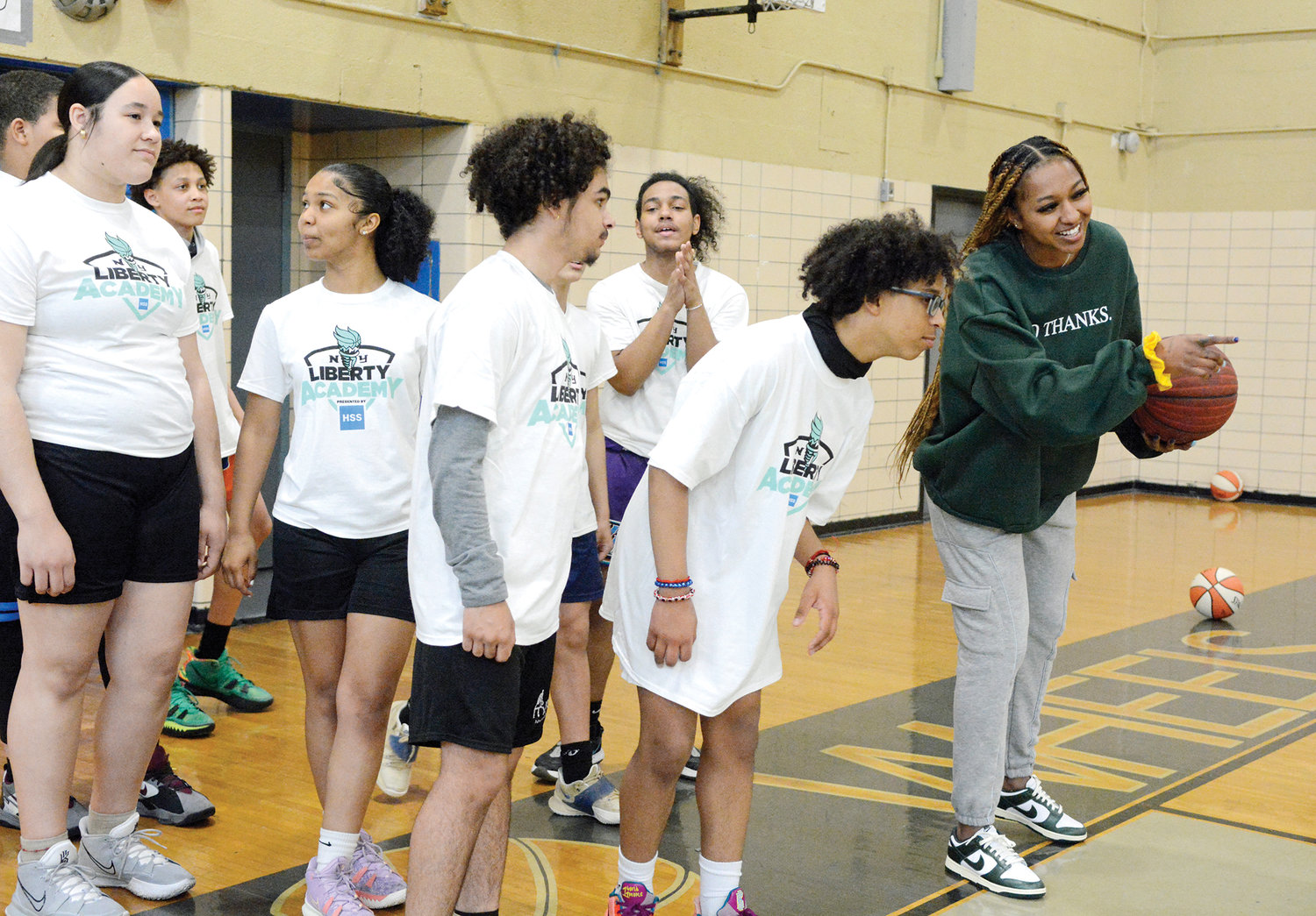 DiDi Richards of the WNBA’s New York Liberty instructs players at Catholic Charities’ Saturday Night Lights youth basketball clinic at La Plaza Beacon School in Manhattan April 9.
