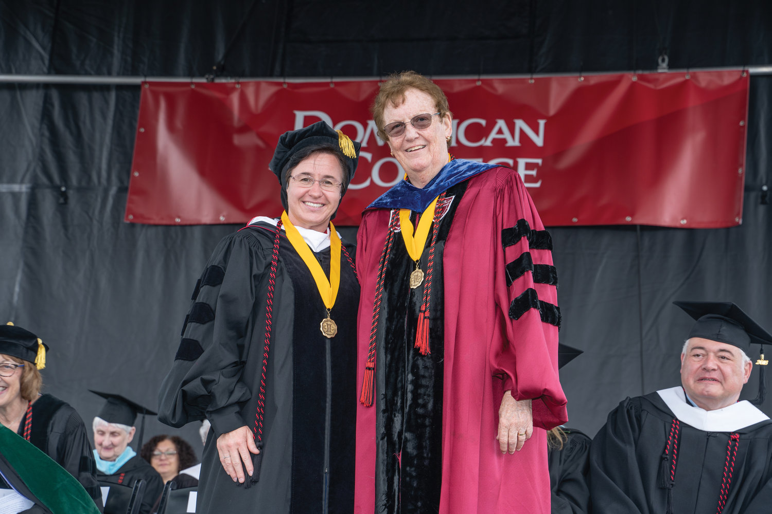 Sister Eliane Ilnitski, S.S.M., provincial superior of the Sisters Servants of Mary Immaculate, left, accepted the Veritas Medal on behalf of her religious congregation at Dominican College’s commencement May 15. She is with Sister Mary Eileen O’Brien, O.P., the college president.