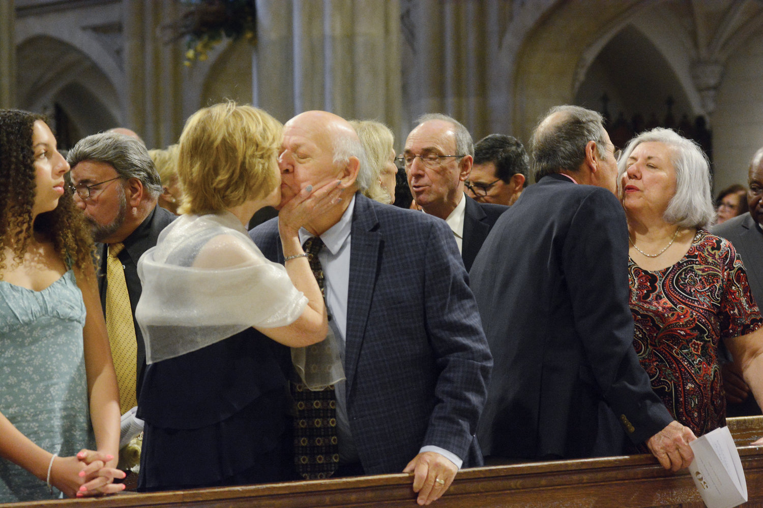 Jubilarians share a kiss after renewing their vows to celebrate their 50th wedding anniversary at the Golden Jubilee Wedding Mass at St. Patrick’s Cathedral June 5.