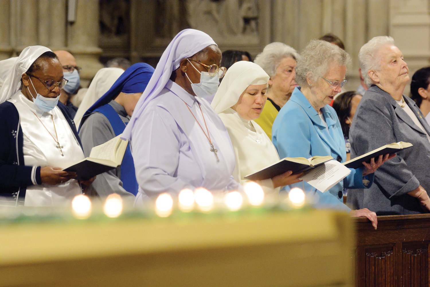 Religious sisters pray together during the morning liturgy.