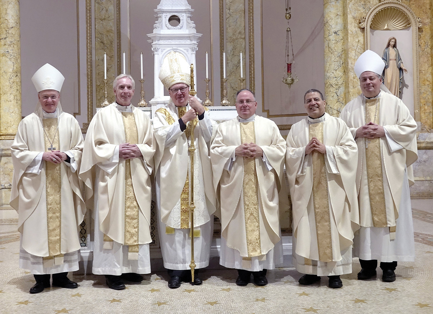 SILVER JUBILARIANS–Members of the Ordination Class of 1997 join Auxiliary Bishop Edmund Whalen, left; Cardinal Dolan and Auxiliary Bishop John Bonnici, right. Marking their jubilees are, from left: Father Robert Dillon, Father Michael Martine and Father Ambiorix Rodriguez.