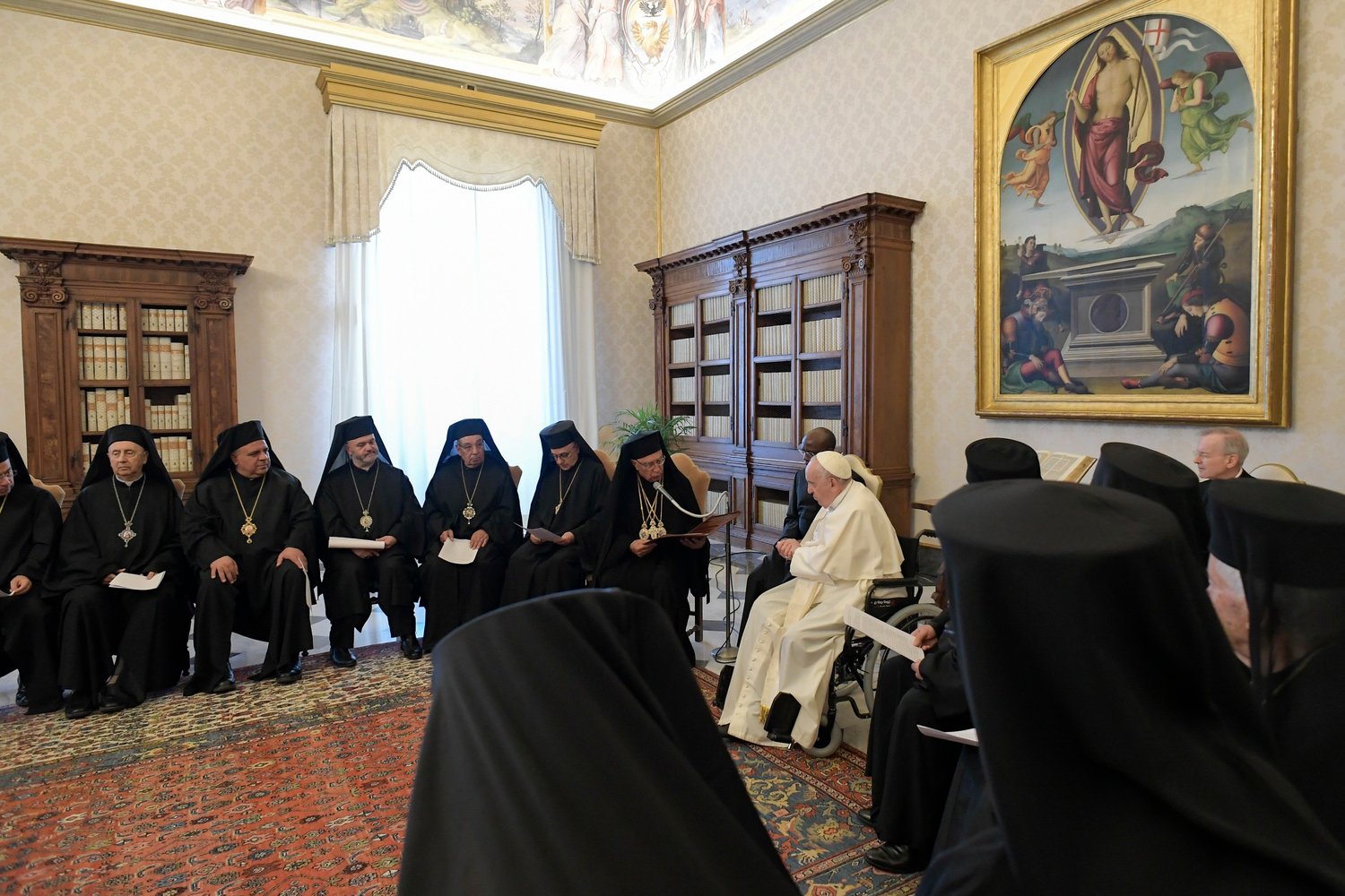 Pope Francis listens as Melkite Patriarch Joseph Absi speaks during an audience with members of the synod of the Melkite Catholic Church at the Vatican June 20. The pope said he shared their concern about the dwindling Christian population of the Middle East.