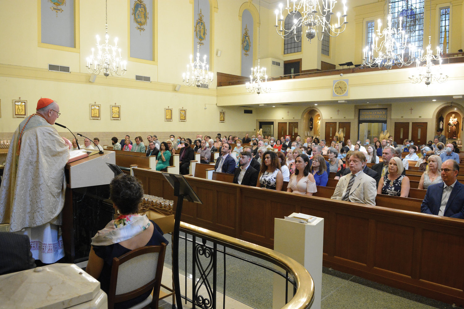 The congregation listens as Cardinal Dolan delivers his homily at the June 25 Mass celebrating the 75th anniversary of Our Lady of Victory Church in Manhattan’s Financial District.