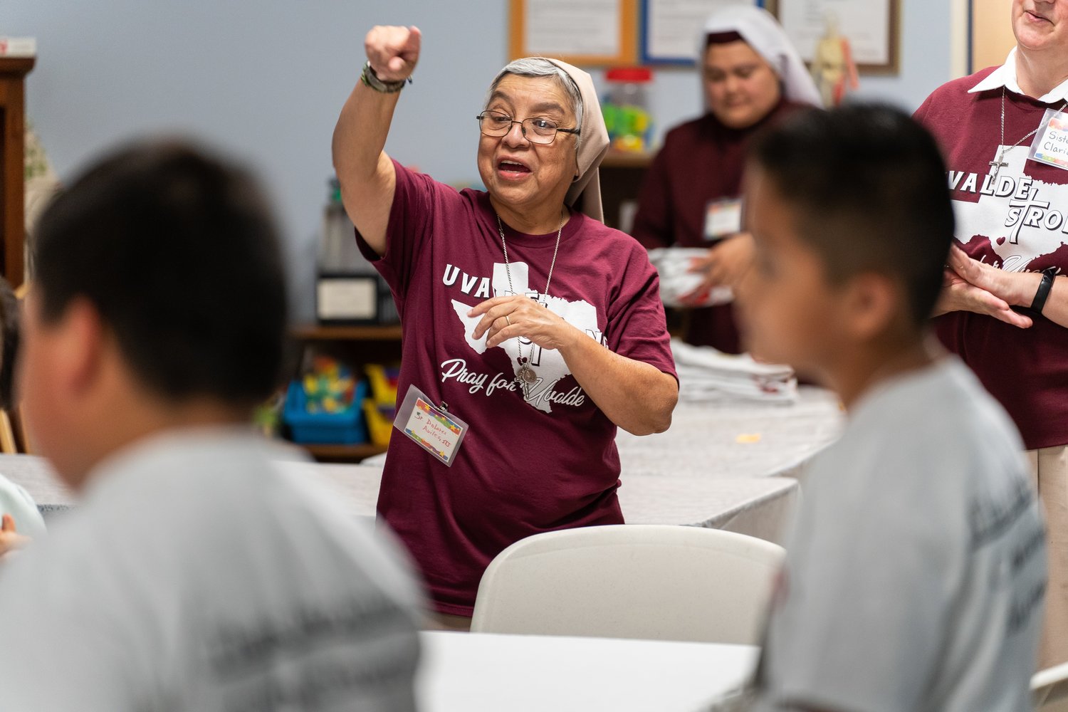 Teresian Sister Dolores Aviles speaks to children attending Camp I-CAN in Uvalde, Texas, July 25.
